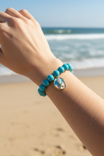 Load image into Gallery viewer, 10mm Blue Howlite w/ Ocean Blue Beach Scene Charm

