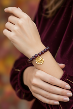Load image into Gallery viewer, Sugar Plum Iridescent faceted Bracelet with Gold Artisan Cardinal Pendant
